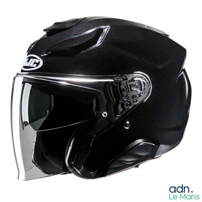 un casque noir avec une visière transparente sur fond blanc