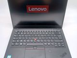 a laptop with a lenovo logo on the screen