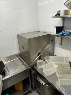 a kitchen with a lot of items on the counter