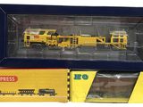 ensemble de petit train jaune et noir dans une boîte jaune