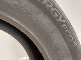 a close up of a tire on a white surface with the word emergency written on it