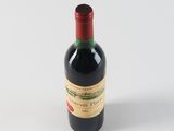a bottle of wine that is sitting on a table
