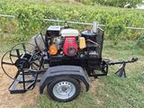 a small trailer with a small engine attached to it
