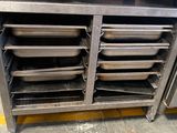 many trays of food in a metal cabinet