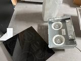 a stove and a microwave sitting on the floor in a room