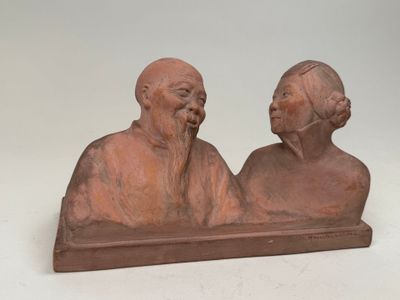 paire de figurines chinoises représentant un vieil homme et une vieille femme