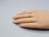 a close up of a person ' s hand with a ring on it