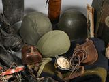 a pile of old military items on a table