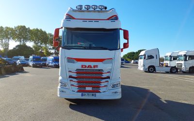 a large white truck parked in a parking lot