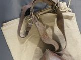 a bag that has a pair of shoes on it