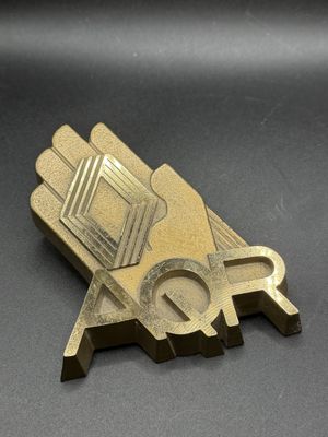 a close up of a metal object on a black surface