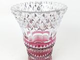 a glass vase that is sitting on a table