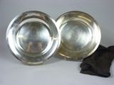 pair of silver plated dishes on stand with cloth and cloth
