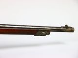a close up of a rifle on a white background