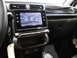 the interior of a car with a steering wheel, dashboard, and radio