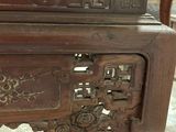 a wooden table with a clock on top of it