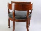 an image of a wooden chair with black leather upholstered seat