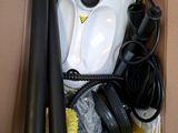 a box with a blow dryer, a hose, and other items in it
