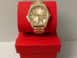 michael korsch watch in a red box on a white surface