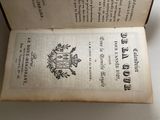 an open book with a picture of a coat of arms on it