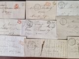 many old envelopes on the table with stamps on them