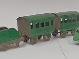 a lot of toy trains that are sitting on a table