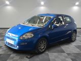 a picture of a small blue car parked in a garage
