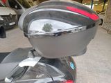 a motor scooter that is parked in a parking lot