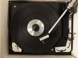 a record player sitting inside of a white box