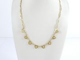 the necklace is made of gold metal and has a heart shaped design