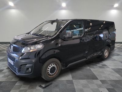 a picture of a black van parked on a checkered floor