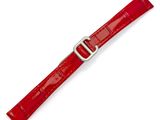 un gros plan d'un bracelet de montre rouge sur fond blanc