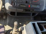 a dashboard of a truck with a steering wheel and a control knob