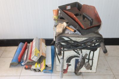 a pile of tools sitting on top of a box