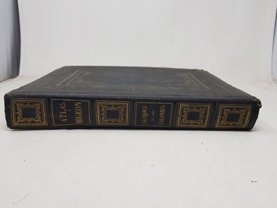 an old book sitting on top of a white table