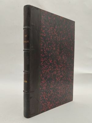 un vieux livre aux pages rouges et noires sur fond blanc