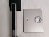 a picture of a bathroom with a toilet paper holder and a toilet paper dispenser