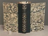 a book that is open on a table with a book in it