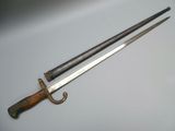 an image of a pair of swords sitting on top of a table