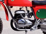 a red motorcycle parked on the side of the road