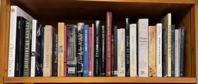 a book shelf with many books on top of it