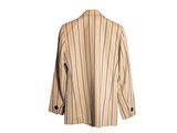 an image of a jacket hanging on a hanger on a white wall