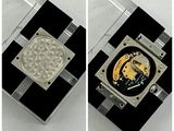 two pictures of a watch with a black and white pattern on it