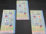 three cards with flags on them are sitting on a table