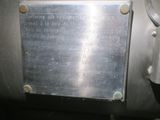 a metal plaque on the side of a machine