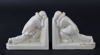 L. FONTINELLE: Paire de serre-livres en céramique craquelée. - Photo 1