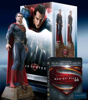 a close up of a statue of superman in front of a box