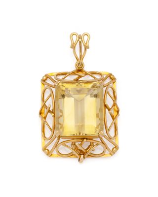 un pendentif en quartz topaze jaune sur fond blanc