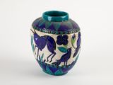 a blue vase with a bird design on it