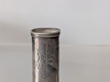a small silver object that is on a table